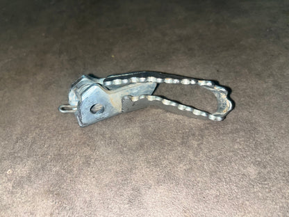 cale pied gauche crf 125